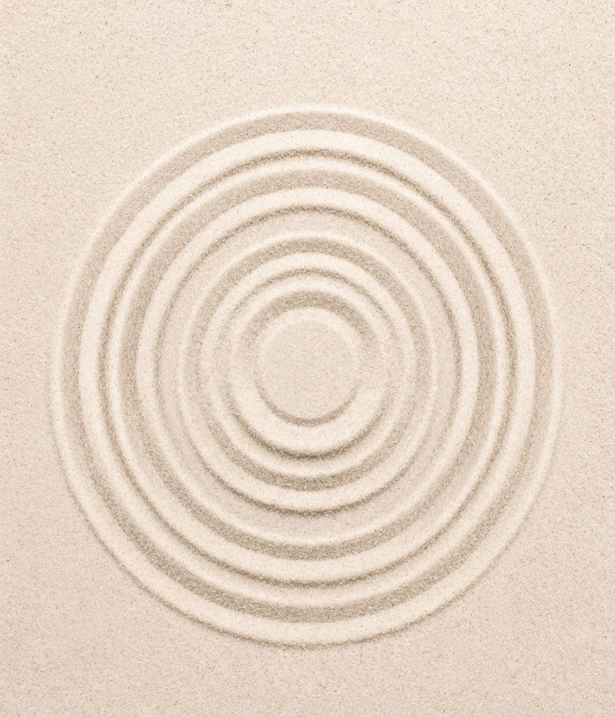 Concentric circles raked into pale sand